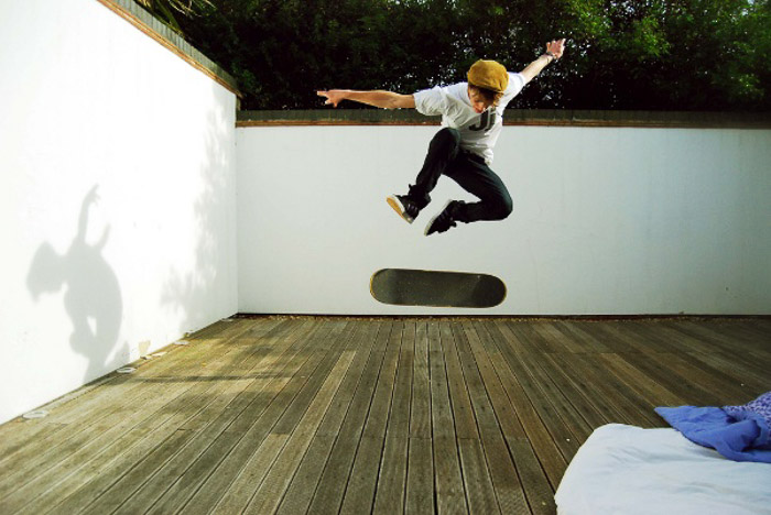 A photo of a skateboarder in mid air demonstrating stability and balance photography