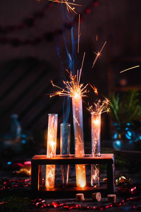 A magic themed still life composition featuring sparklers and test tubes